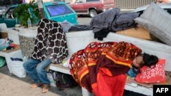 Relatives of patients remain outside the General Hospital in Mexico City on May 9, 2020, amid the COVID-19 pandemic. 