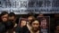 资料照：香港民众手举当时被中国政府监禁的维权律师的画像表达对中国人权律师的支持。（2017年7月9日）