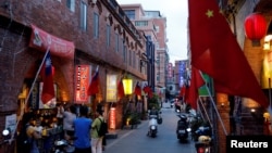 File--Chinese and Taiwanese flags are displayed around souvenir shops, in Kinmen, Taiwan August 19, 2018. 