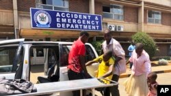 A family brings a sick relative to Parerenyatwa Hospital in Harare, Oct, 14, 2019. 