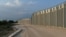 FILE - View of a border fence between Greece and Turkey, in Alexandroupolis, Greece, Aug. 10, 2021. 