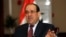 Iraq's Prime Minister Nuri al-Maliki speaks during exclusive interview with Reuters, in Baghdad, Jan. 12, 2014.