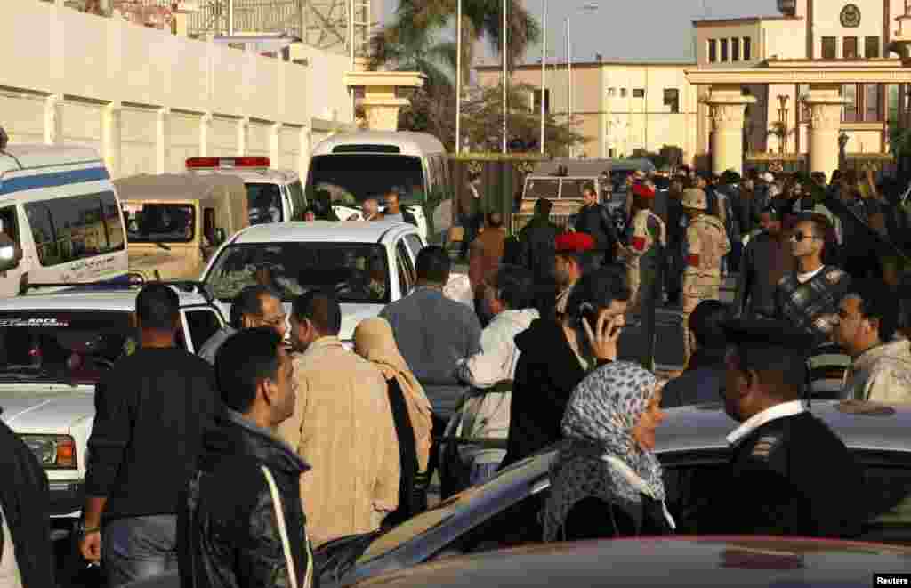 Relatives of security personnel killed in al-Arish leave the Almaza military airbase where the funerals were held in Cairo, Jan. 30, 2015.