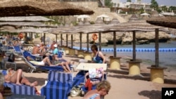Tourists at the beach of the Red Sea tourist resort of Sharm el-Sheik, Egypt, Feb. 21, 2011. 