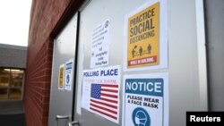 Warning signs are seen outside Highland Elementary School during the U.S. presidential election in Ambridge, Beaver County, Pennsylvania, Nov. 3, 2020. 