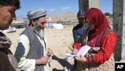 Hameeda Danesh, a candidate for Parliament, camapaigns in Wardak province, central Afghanistan. Danesh. She is competing against six men to represent the deeply conservative district of Jalrez in Wardak province, where Taliban hold sway in vast tracts of the countryside. Oct. 14, 2018 photo. (AP Photo/Rahmat Gul)