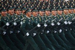 Soldiers of People's Liberation Army (PLA) march in formation past Tiananmen Square during a rehearsal before a military parade marking the 70th founding anniversary of People's Republic of China, on its National Day in Beijing, China, Oct. 1, 2019.