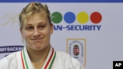 Polling officers and police officers wait in line as they prepare to go to their polling centers ahead of the first provincial polls in 25 years in Jaffna, a former war zone in northern Sri Lanka, about 400 kilometres (249 miles) north of Colombo.