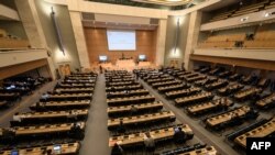 FILE - This photograph taken on Sept. 18, 2020, shows a general view on the opening of a meeting of the UN Human Rights Council on allegations of torture and other serious violations in Belarus, in Geneva.