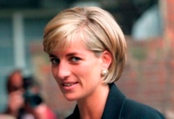 FILE - Princess Diana arrives at the Royal Geographical Society in London for a speech on the dangers of landmines throughout the world, June 12, 1997.
