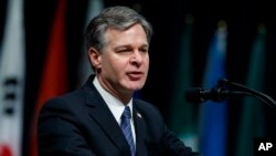 FILE - FBI Director Christopher Wray speaks during the FBI National Academy graduation ceremony, Dec. 15, 2017, in Quantico, Virginia.
