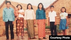 The Mells posed for a family photo in Thailand's Khao I Dang refugee camp. (Courtesy of Sameth Mell)