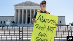 The Rev. Patrick Mahoney demonstrates as the U.S. Supreme Court announces decisions on Capitol Hill in Washington, June 21, 2024. The court upheld a law that prevents people who are subject to a restraining order for domestic violence from possessing firearms.