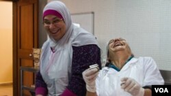 These Lebanese women are from two religious communities (the Bab Al-Tebbeneh and Jabal Mohsen) and should be enemies. But don't tell them that. They are too busy making money for their families, peace for their communities and just having fun together, December 2014. (J. Owens / VOA)