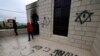 Israeli settlers accused of setting fire to and vandalizing West Bank mosque