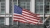 FILE - A flag flies behind an enclosure on the territory of the U.S. embassy in Moscow, Russia March 28, 2018.