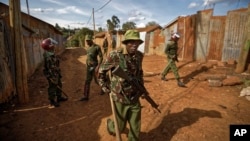Kenyan police search shack to shack in small alleyways, looking for those commanding stone-throwing opposition protesters, in the Kawangware area of Nairobi, Oct. 28, 2017. Kenyan opposition areas were generally calmer Saturday, though clashes between supporters of opposition leader Raila Odinga and police continued in Kawangware, and it was still not clear when the presidential election, a rerun of the flawed vote in August, would be over.
