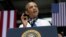 President Barack Obama gestures as he speaks at the Amazon fulfillment center in Chattanooga, Tennessee, July 30, 2013. 
