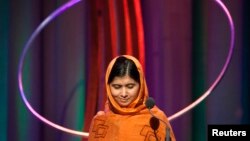 FILE - Malala Yousafzai gives a speech after receiving the "Leadership in Civil Society" award at the Clinton Global Initiative 2013 in New York September 25, 2013.