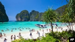 In this March 4, 2017, photo, tourists enjoy the popular Maya bay on Phi Phi island, Krabi province. (AP Photo/Rajavi Omanee)
