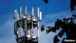 FILE - Relay antennas for mobile phone networks are pictured on a relay mast near Gross-Gerau, April 25, 2019. 