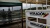 The Colombian migration logo is seen on a fence on the Simon Bolivar cross-border bridge between Venezuela and Colombia, in Cucuta, Colombia, Feb. 27, 2019. 