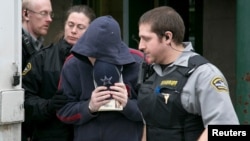 FILE - Jeffrey Delisle leaves court following his sentencing at the provincial court in Halifax, Nova Scotia, Feb. 8, 2013. 