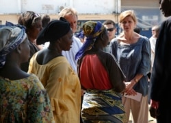 FILE - U.S. Ambassador to the United Nations Samantha Power speaks to IDP women at the makeshift camp where over 40,000 found refuge at the airport in Bangui, Central African Republic, Dec. 19, 2013.