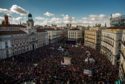 FILE - People fill the main square of Madrid during a march by members of the Podemos party, which hopes to emulate the electoral success of Greece's Syriza party in elections later this year, Jan. 31, 2015.