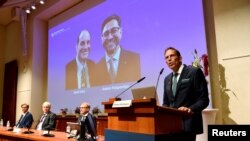 Thomas Perlmann, Secretary of the Nobel Assembly and the Nobel Committee, announces the winners of the 2021 Nobel Prize in Physiology or Medicine David Julius and Ardem Patapoutian (seen on the screen) during a press conference at the Karolinska Institute