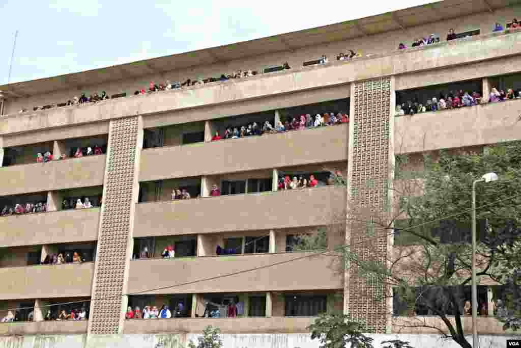 Female students watch a protest against the Egyptian government and media at Al-Azhar University in Cairo, Dec. 11, 2013. (Hamada Elrasam for VOA)