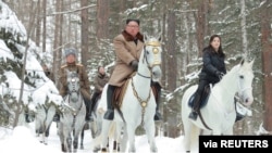 North Korean leader Kim Jong Un rides a horse as he visits battle sites in areas of Mt Paektu, Ryanggang, North Korea, in this undated picture released by North Korea's Central News Agency (KCNA), Dec. 4, 2019.
