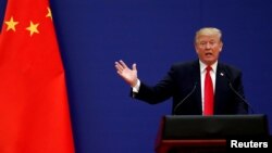 FILE - U.S. President Donald Trump speaks at the Great Hall of the People in Beijing, China, Nov. 9, 2017. 