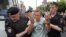 RUSSIA --Policemen detain Russian opposition leader Aleksei Navalny during a rally in support of investigative journalist Ivan Golunov, who was detained by police, accused of drug offense and later freed from house arrest, in Moscow, June 12, 2019.