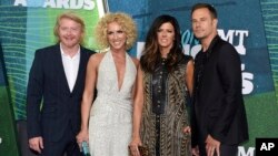 FILE - Phillip Sweet, from left, Kimberly Schlapman, Karen Fairchild and Jimi Westbrook, of Little Big Town, arrive at the CMT Music Awards at Bridgestone Arena in Nashville, Tennessee, June 10, 2015.