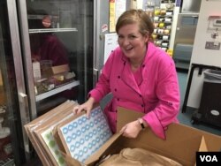 Sarah Dwyer says making chocolate-covered caramels the old fashioned way has given her a dream career while spreading joy to people. (VOA Photo/J.Taboh)