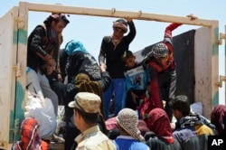 Fallujadan qochib ulgurgan oddiy fuqarolar