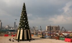 FILE PHOTO A Christmas tree with names of those who died during Beirut port explosion, is seen near the damaged grain silo, in Beirut, Lebanon December 22, 2020. REUTERS/Mohamed Azakir