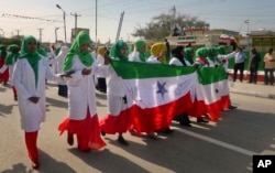 FILE - Women march in a procession to celebrate the 25th anniversary of proclaimed independence in the capital Hargeisa, Somaliland, a breakaway region of Somalia, May 18, 2016.