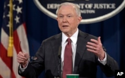 FILE - Attorney General Jeff Sessions is pictured at the Justice Department in Washington, March 2, 2017. On March 27, he warned that cities and states protecting immigrant felons from deportation could face cuts in federal grants.