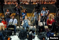 Journalists cover U.S. Democratic presidential candidate Bernie Sanders as he addresses supporters at a campaign rally in Lancaster, Pennsylvania, April 22, 2016.