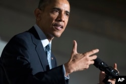President Barack Obama speaks during a naturalization ceremony at the National Archives in Washington, Dec. 15, 2015.