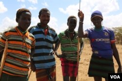 Pokot herders watch their cattle in Mugie Conservancy, Laikipia, Kenya, March 18, 2017. (J. Craig/VOA)