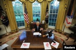 U.S. President Donald Trump speaks during an interview with Reuters in the Oval Office of the White House in Washington, April 27, 2017.