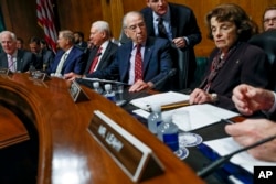 From left, Senate Majority Whip Sen. John Cornyn, R-Texas, Sen. Lindsey Graham, R-S.C., Sen. Orrin Hatch, R-Utah, Senate Judiciary Committee Chairman Chuck Grassley of Iowa, and Ranking Member Sen. Dianne Feinstein, D-Calif., gather before a Senate Judiciary Committee meeting on Capitol Hill in Washington, Sept 28. 2018.