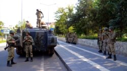 FILE - Turkish army tanks are stationed in Diyarbakir, Turkey, Oct. 8, 2014, hours after violent protests between Kurdish protesters and Turkish police, part of Europe-wide demonstrations against the Islamic State group's advance on the town of Kobani on the Syrian-Turkish border.