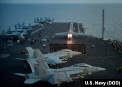 An F/A-18E Super Hornet from the Strike Fighter Squadron (VFA) 137 “Kestrels” takes off from the aircraft carrier USS Carl Vinson (CVN 70) flight deck in South China Sea, April 12, 2017.