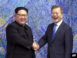 FILE - North Korean leader Kim Jong Un, left, and South Korean President Moon Jae-in inside the Peace House at the border village of Panmunjom in Demilitarized Zone, South Korea, April 27, 2018.