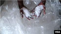 Lilian Wairimu has upgraded from rugged mattress foam to a type of plastic foam that she says is of high quality. (M. Yusuf/VOA)