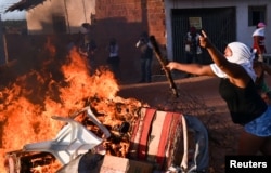 Relatives of inmates protest against the transfer of prisoners to another prison in front of Alcacuz prison in Natal, Rio Grande do Norte state, Brazil, Jan. 18, 2017.